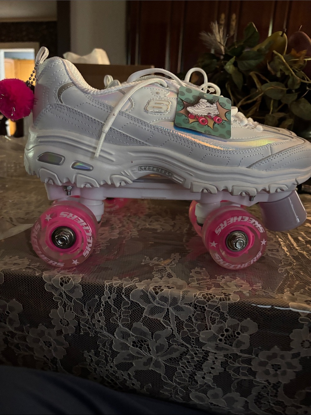 Skechers Women's 4 Wheeler Fly Cruiser roller skates in white with holographic